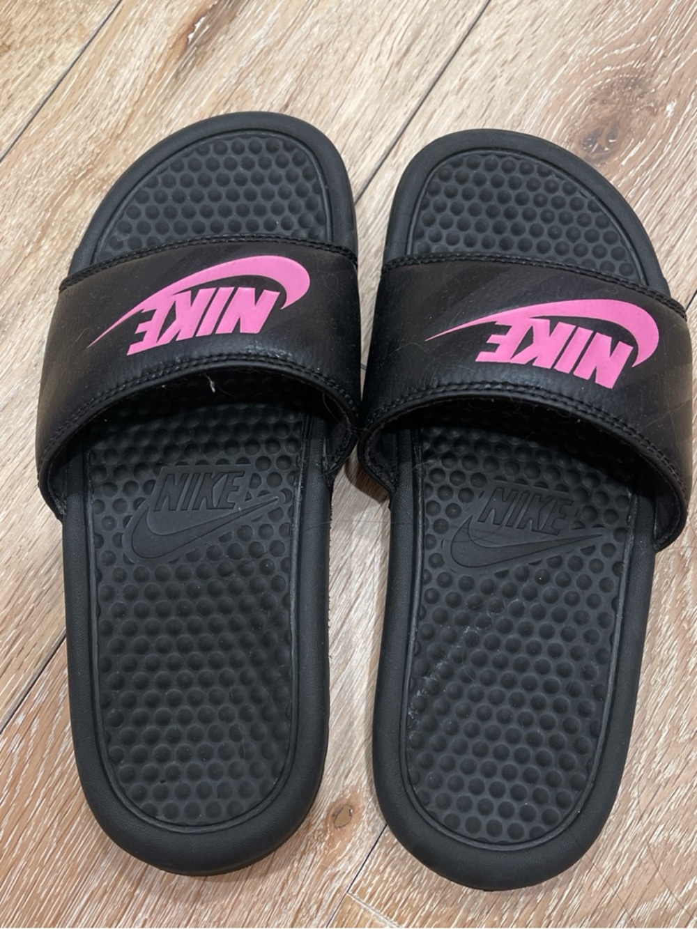 Nike Black Slides with Pink Swoosh Logo